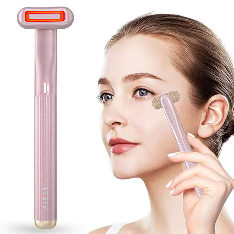 Rotary eye massage therapeutic warmth skincare tool with red LED.