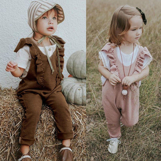 Baby girl in a knitted ruffle jumpsuit, long sleeve romper, brown and pink options available.
