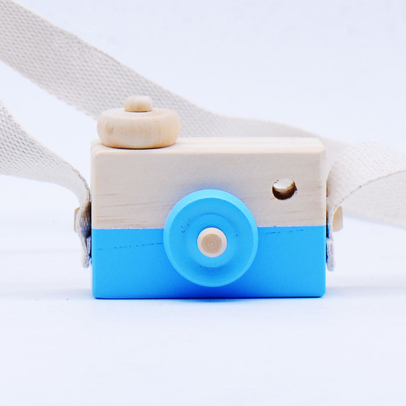 Wooden toy camera for kids, blue and natural wood colors, suitable for ages 3 and up.