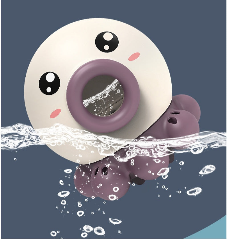 Octopus fountain bath toy with water jet feature, floating and spinning in water for kids' playtime.