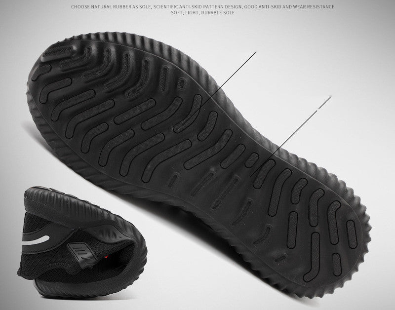 Durable black anti-skid sole of breathable work safety shoe with flexible design.