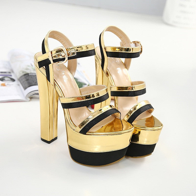 Golden high platform stage heels with ankle straps and viscose sole.