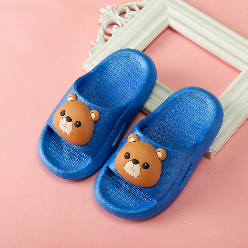 Blue kids' sandals with bear design and flat PVC sole.