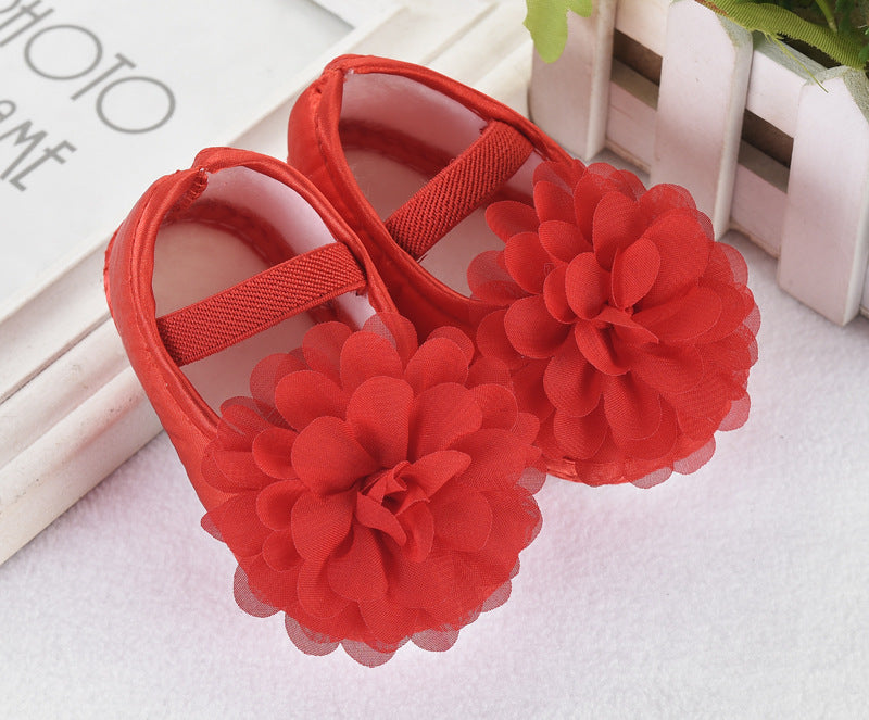 Baby Toddler Princess Shoes in red silk with floral decoration and anti-slip sole.
