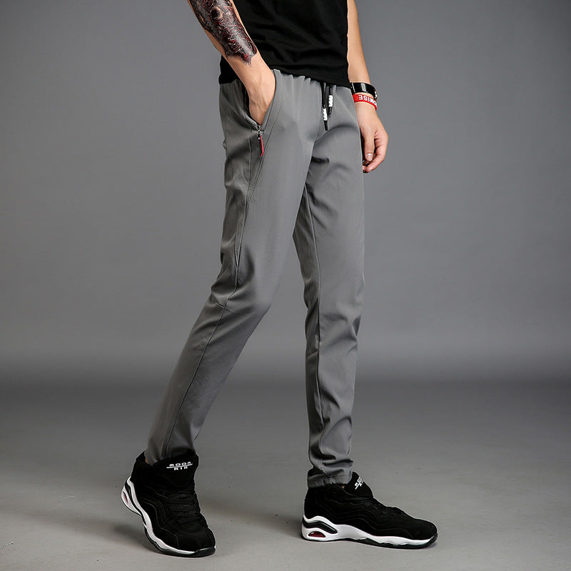Men's slim straight casual pants in gray, featuring pocket decoration and micro-elastic fabric.