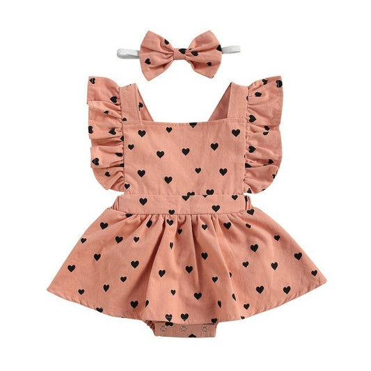 Girls cute pink dress with bow and heart pattern for kids.