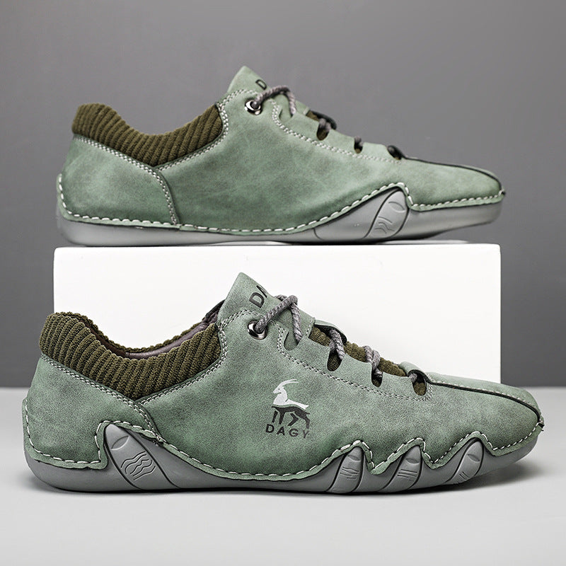 High quality men's sneakers in green, lace-up casual flats with car stitching details.