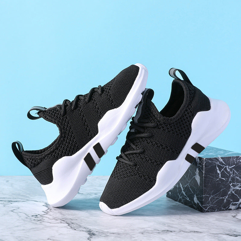 Kids' lightweight breathable sports shoes with fly knit design, black mesh upper, and MD sole.