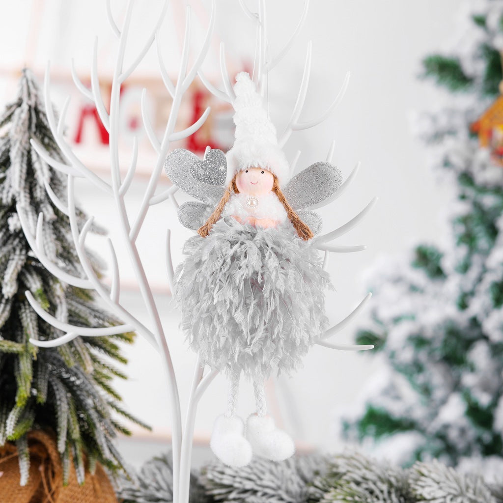 Christmas angel pendant decoration in gray cloth, displayed on a tree branch.