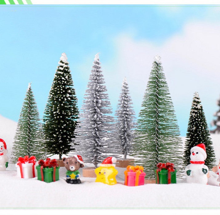 Festive Christmas tree ornaments with gifts and figures in snowy landscape