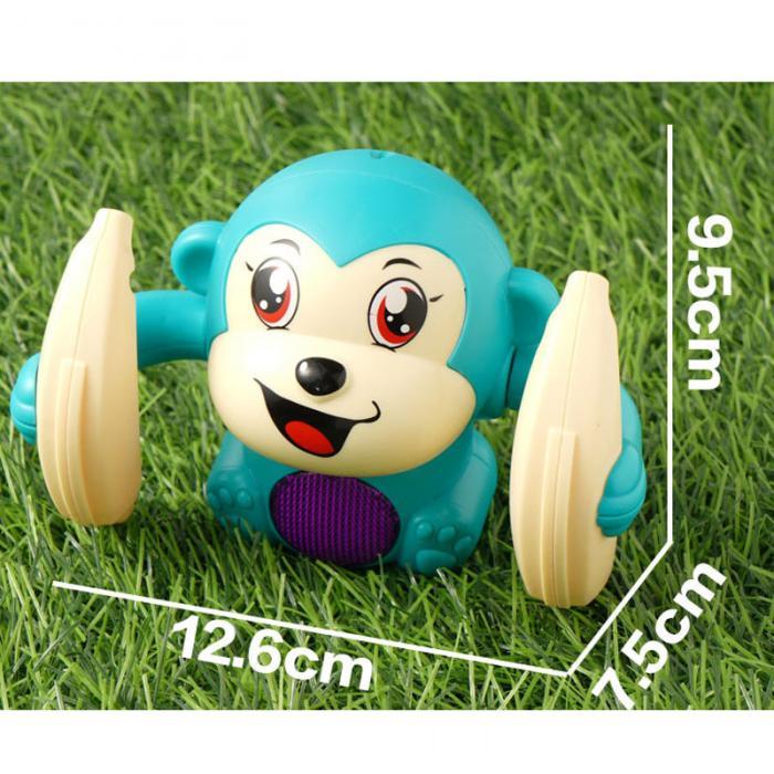 Light-up tumbling monkey toy on grass with size dimensions marked.