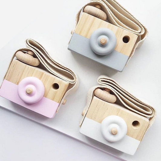 Cute wooden toy cameras for kids, made from high-quality wood, suitable for ages 3 and up.