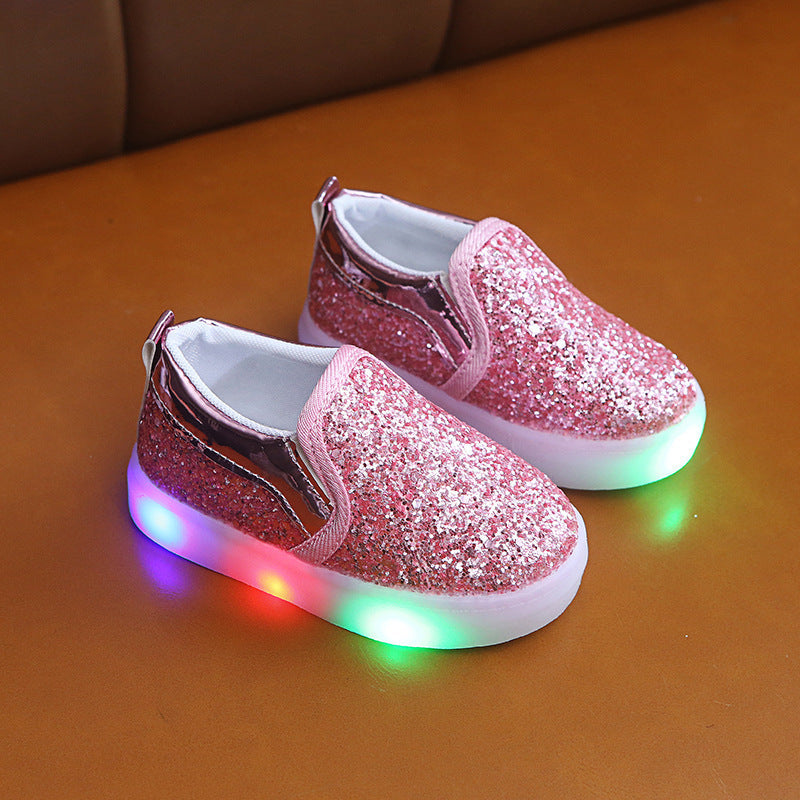 Kids LED sneakers in pink sequin with light-up soles, suitable for boys and girls.