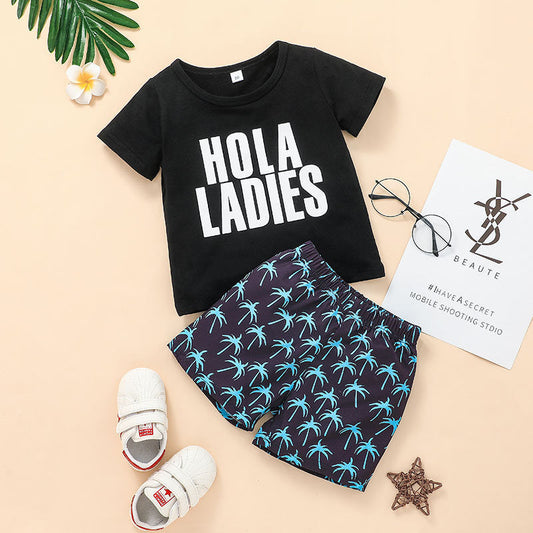 Boys' summer clothing set with black letter T-shirt and palm tree shorts.