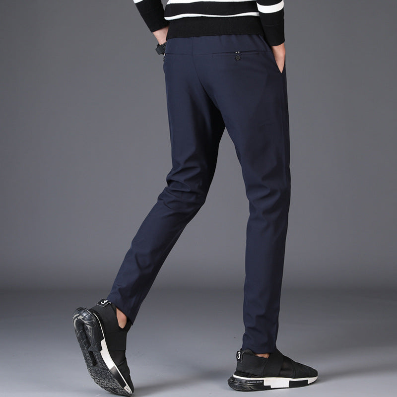 Men's navy blue casual slim straight trousers with pocket decoration.