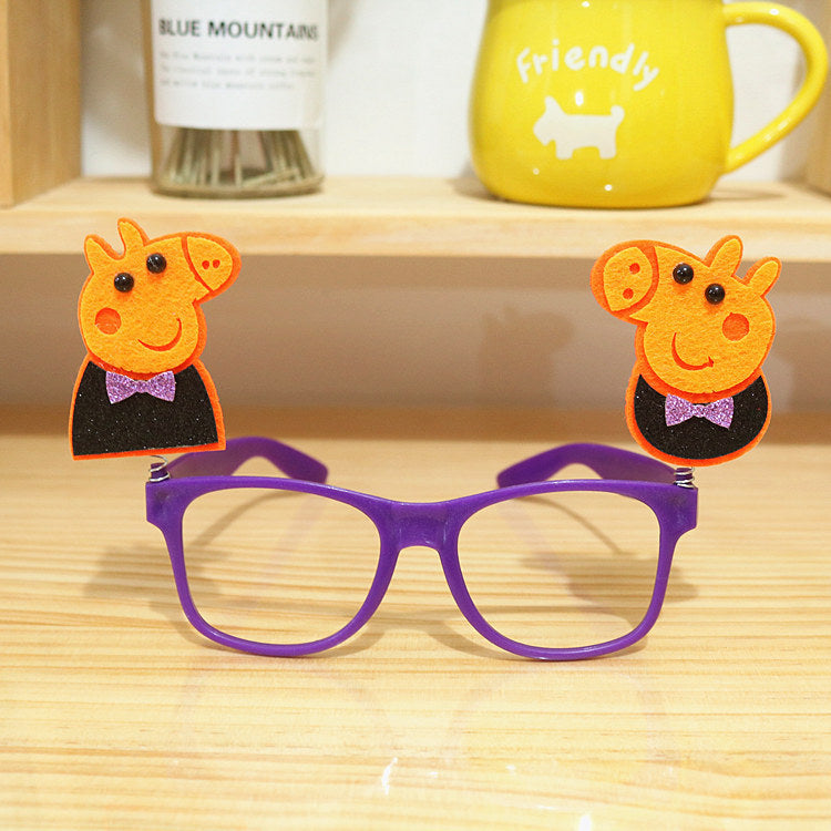 Purple Halloween glasses with pumpkin figures and pointed hats.