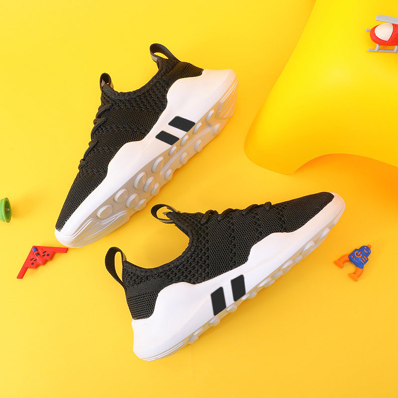 Kids' lightweight breathable sports shoes with fly knit design and MD sole on a yellow background.