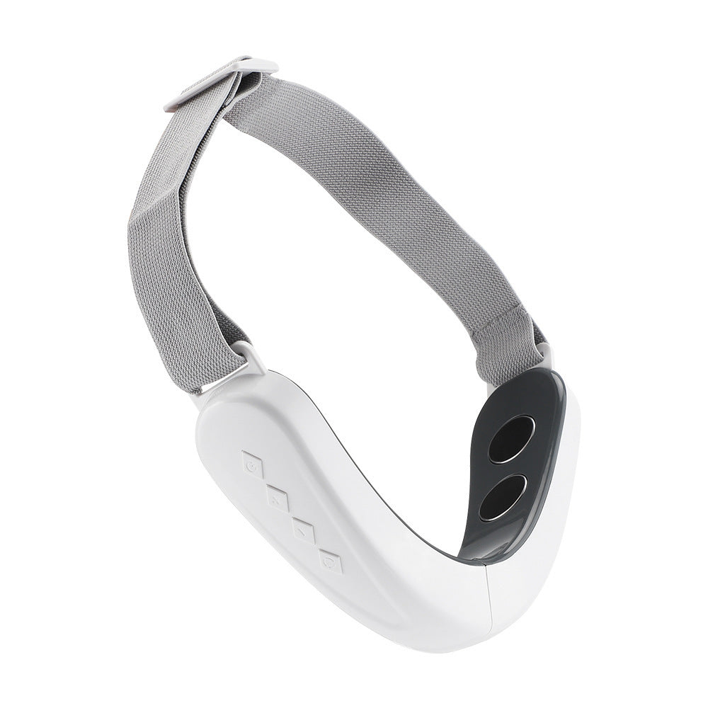 Micro-current facial massager with adjustable strap in white.