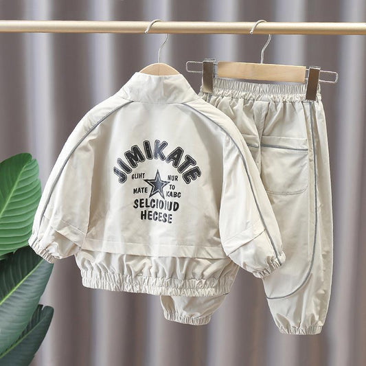 Trendy kid's two-piece suit in cotton with print, stylish design, available in multiple colors.