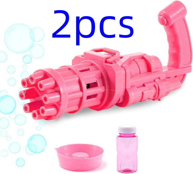 Pink kids bubble machine toy with bubble solution and dish accessory, powered by 3 AA batteries.
