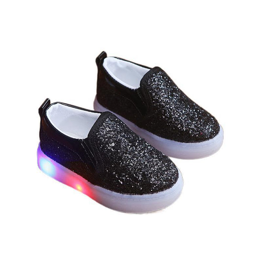 Kids LED sneakers in black with light-up soles and sequin details for toddlers.