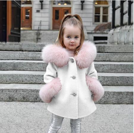 Girls' pink cashmere woolen overcoat with fur trim, winter fashion.