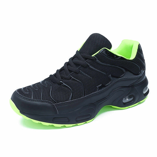 Mens Breathable Mesh Sneakers in black with bright green lining and outsole accents, shown from an angled side view.