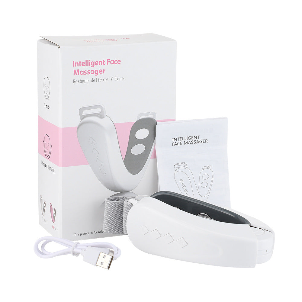 Micro-current facial massager in white with packaging and USB cable.