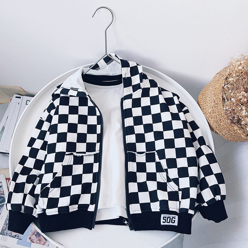 Children's hooded plaid coat in black and white cotton, Korean style jacket hanging on rack.