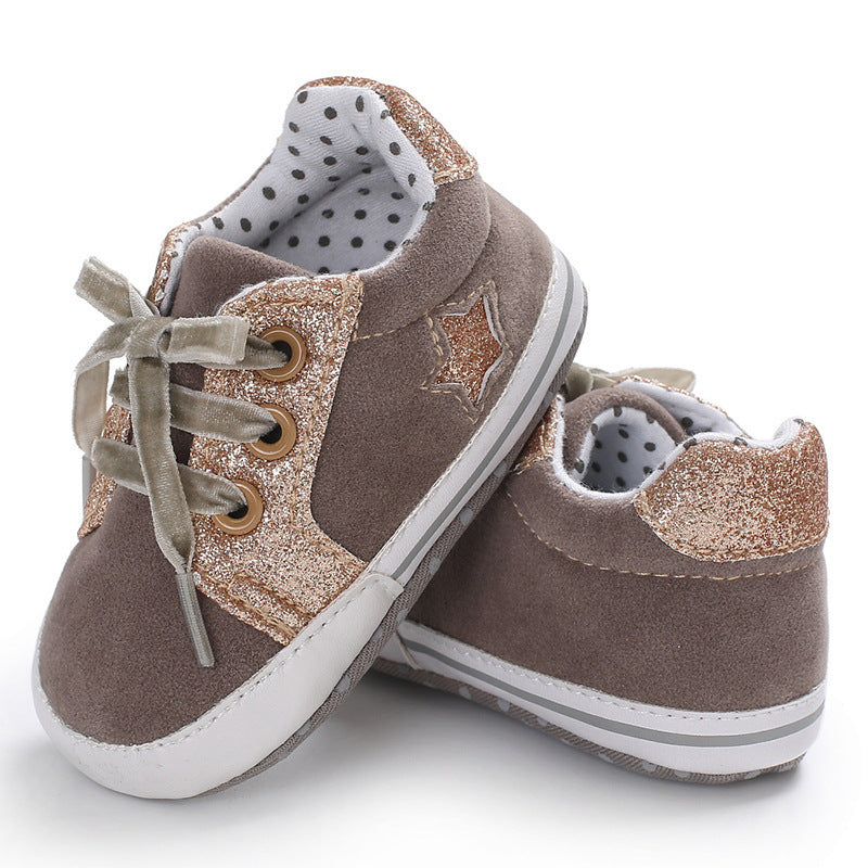 Stylish brown baby sneakers with low top design for toddlers.