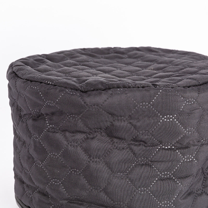 Black two-speed tempering home heating hair cap with quilted design.