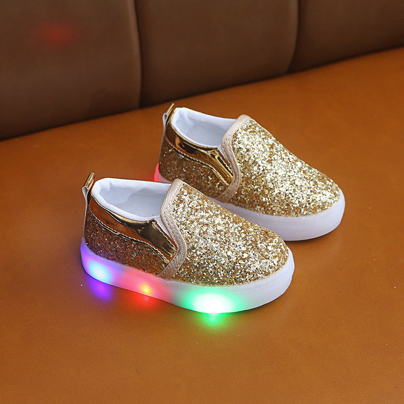 Kids LED sneakers in gold with light-up soles, sequin design for toddlers.