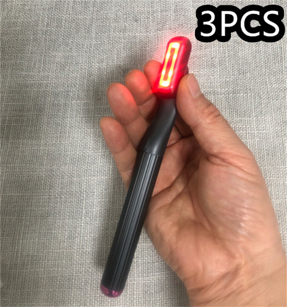 New upgraded 360 degrees rotary eye massage wand with red LED light in hand.
