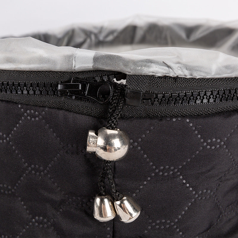 Close-up of a black two-speed tempering home heating hair cap with zipper and cord detail.