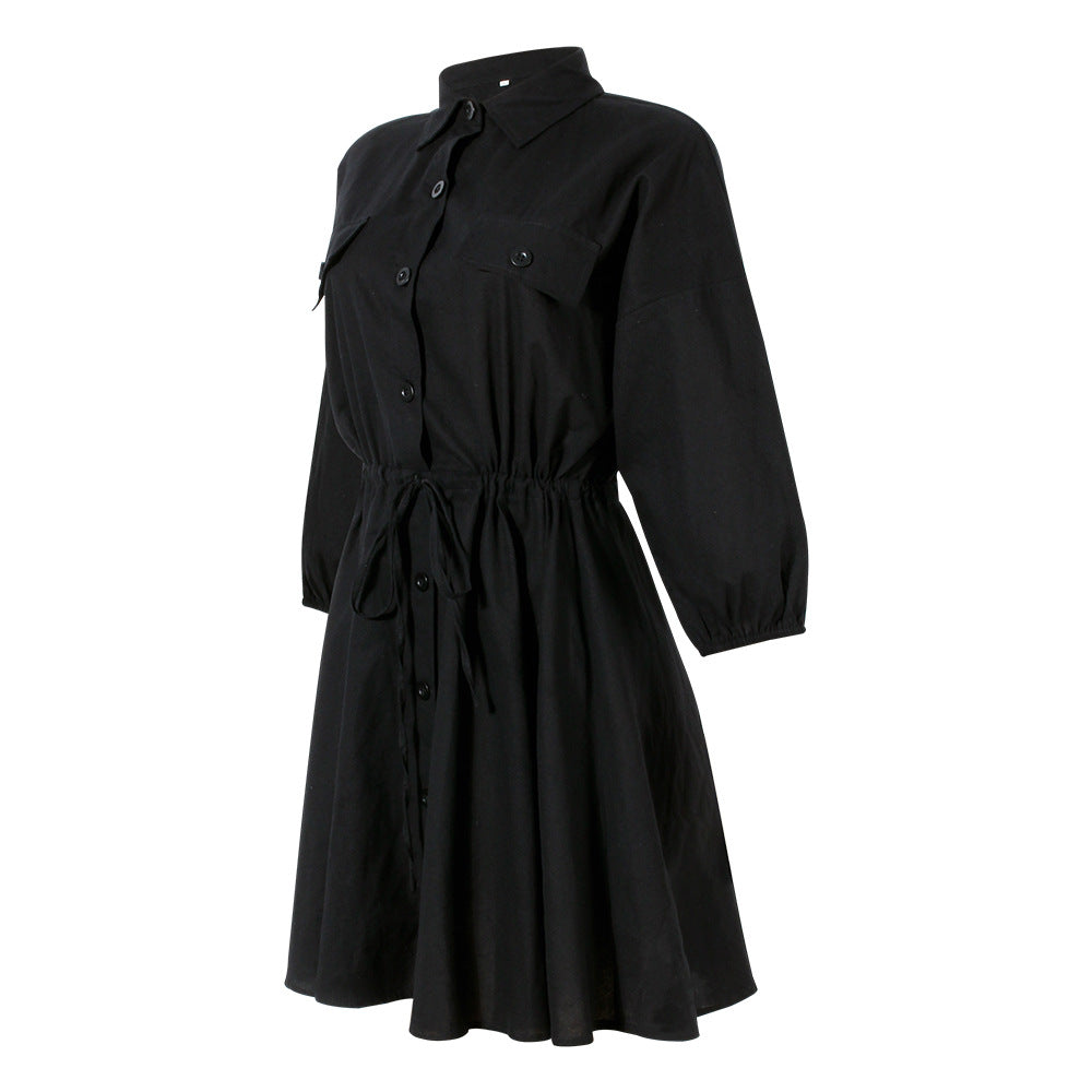 Black casual dress with button-up front, waist tie, and long sleeves.