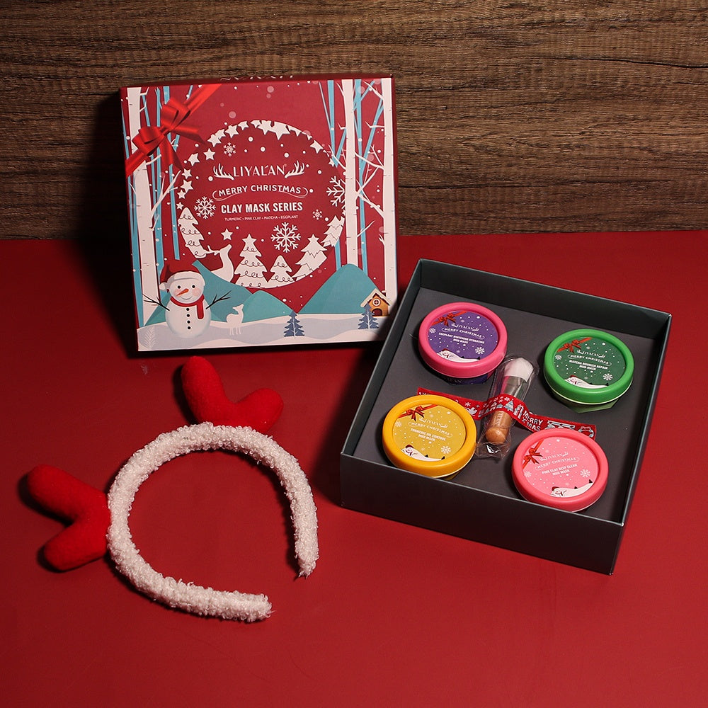 Christmas-themed organic mud clay mask gift set with hair band and brush, features four facial masks in a holiday box.