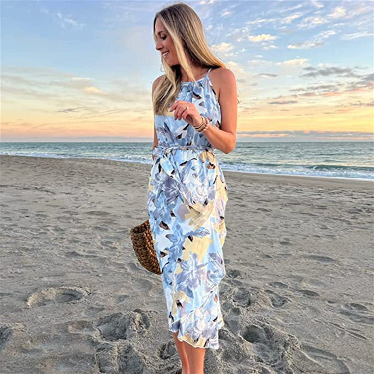 Elegant floral shirt dress for women on a beach at sunset.