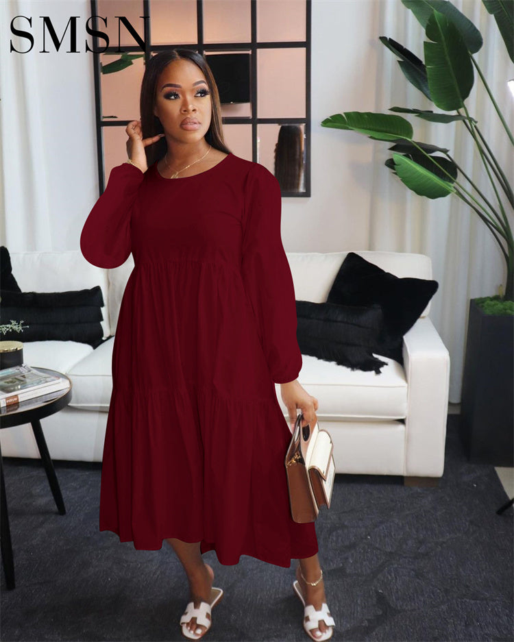 Trendy solid color long sleeve plus size dress for women in dark red, casual style.