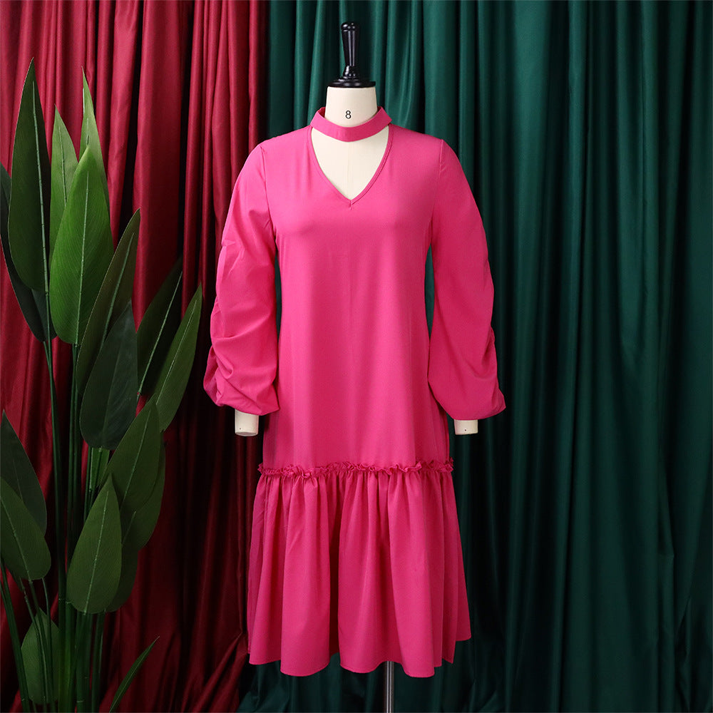 Custom loose women's knee-length fall dress in solid pink, suitable for casual or formal occasions.