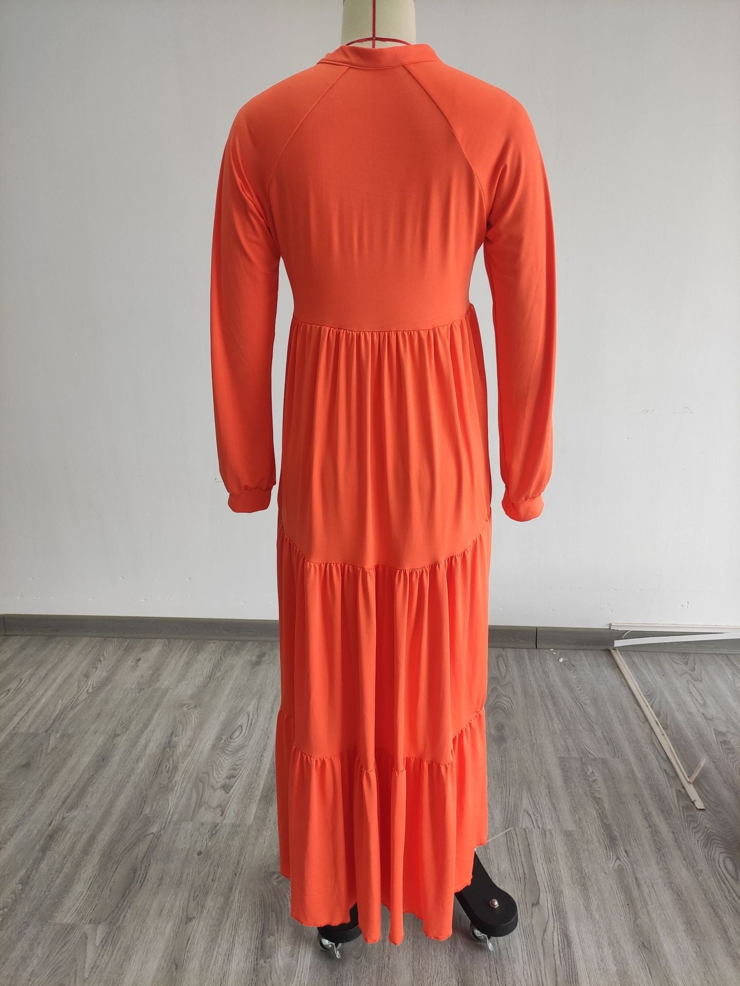 Autumn 2023 women's loose-fit long sleeve orange casual dress, back view.