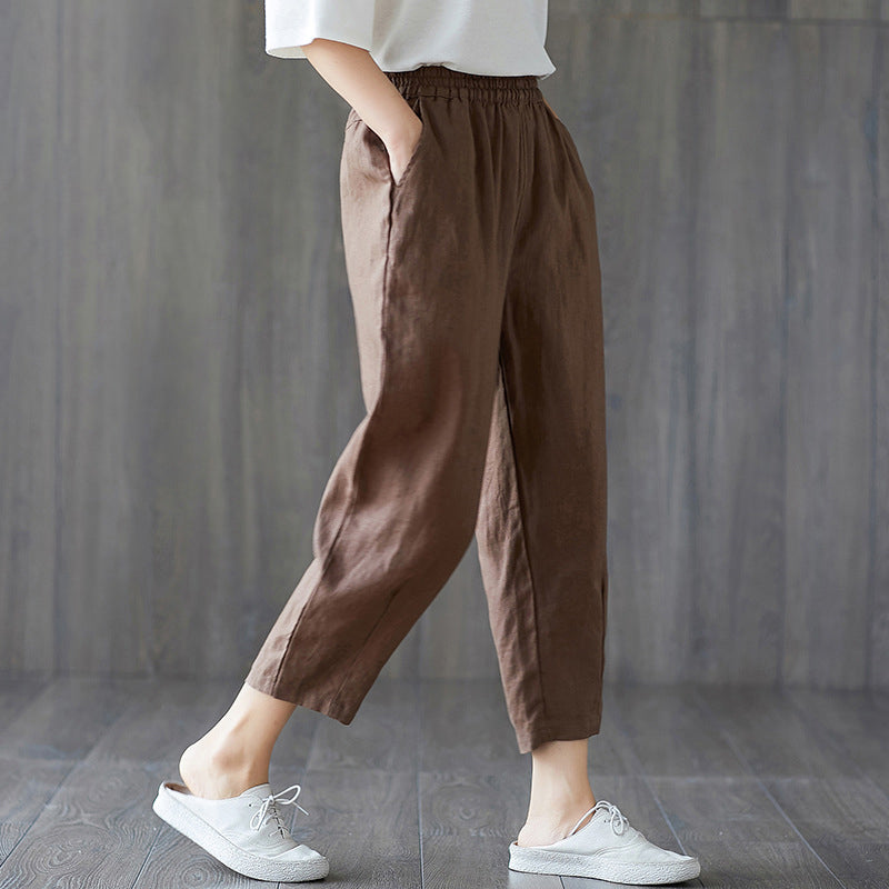 Womens Cotton Carrot Pants in brown shown in a relaxed side view