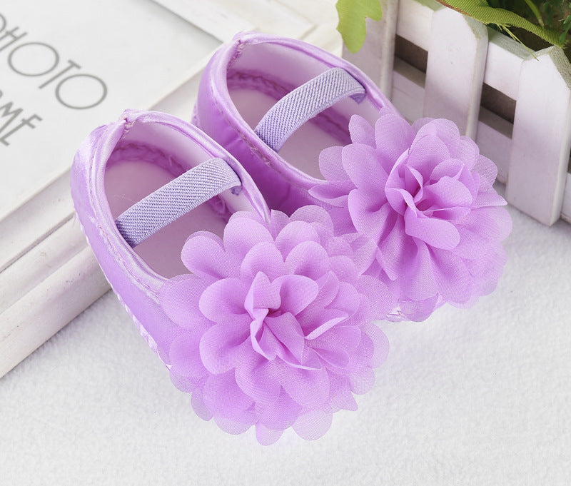 Baby Toddler Princess Shoes in purple silk with floral decoration and anti-slip sole.