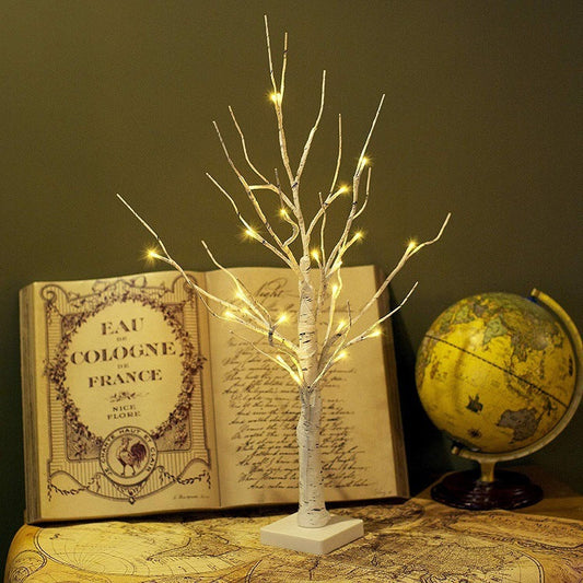Christmas decoration lights illuminating birch tree with warm glow, ideal for living room and garden.