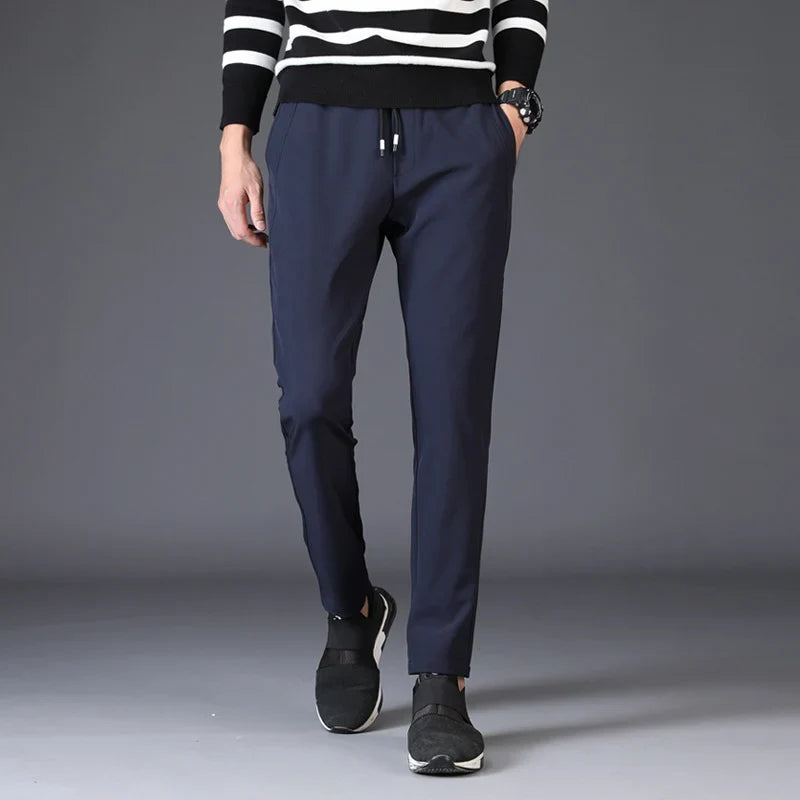 Mens Slim Fit Trousers in royal blue shown from the front with drawstring waist and side pockets