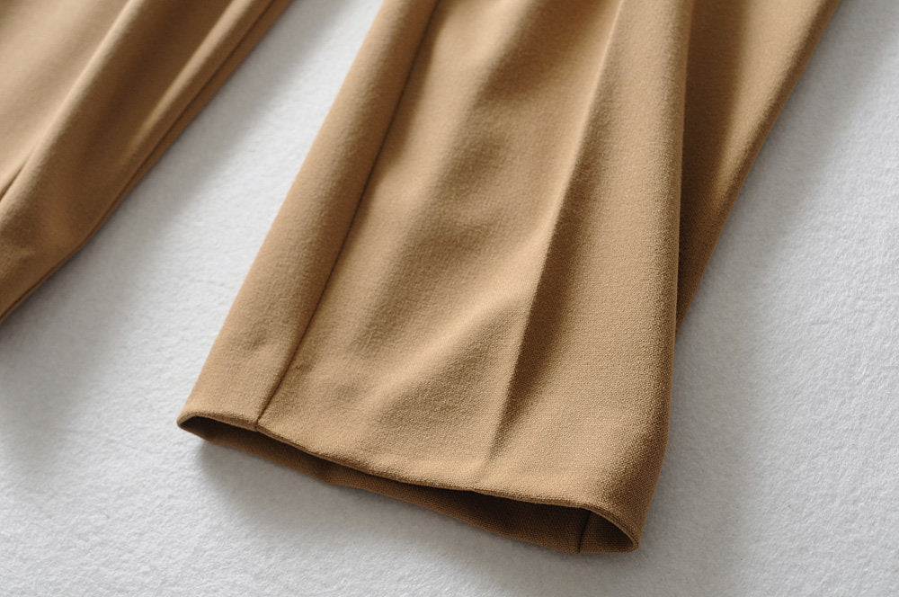 Belted High-Waist Trousers in khaki showing a close-up of the leg opening, fabric texture and hem