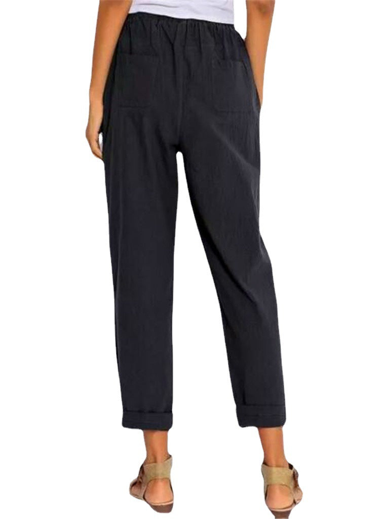 Casual Harem Pants in a dark shade, shown from the front with both legs straight and ankle length styling