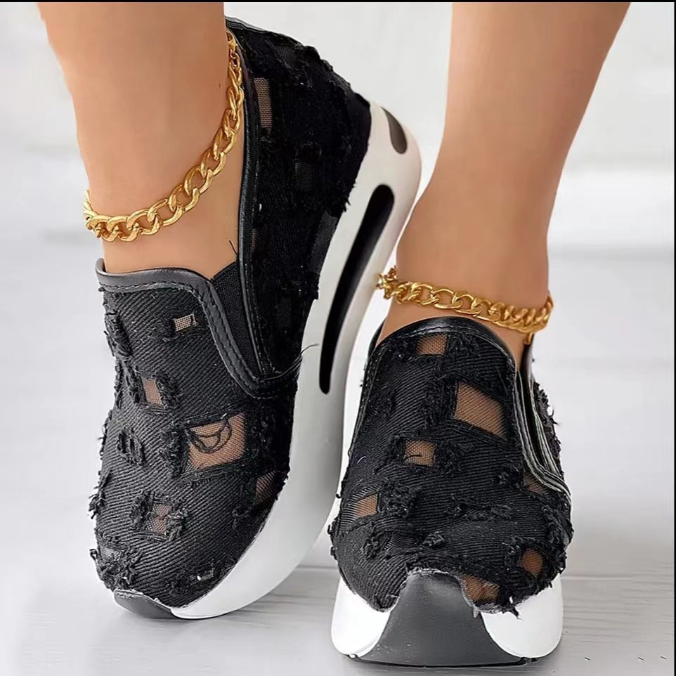 Hollow Out Canvas Shoes in black with distressed rectangular cut-outs and contrasting white platform soles, shown worn.