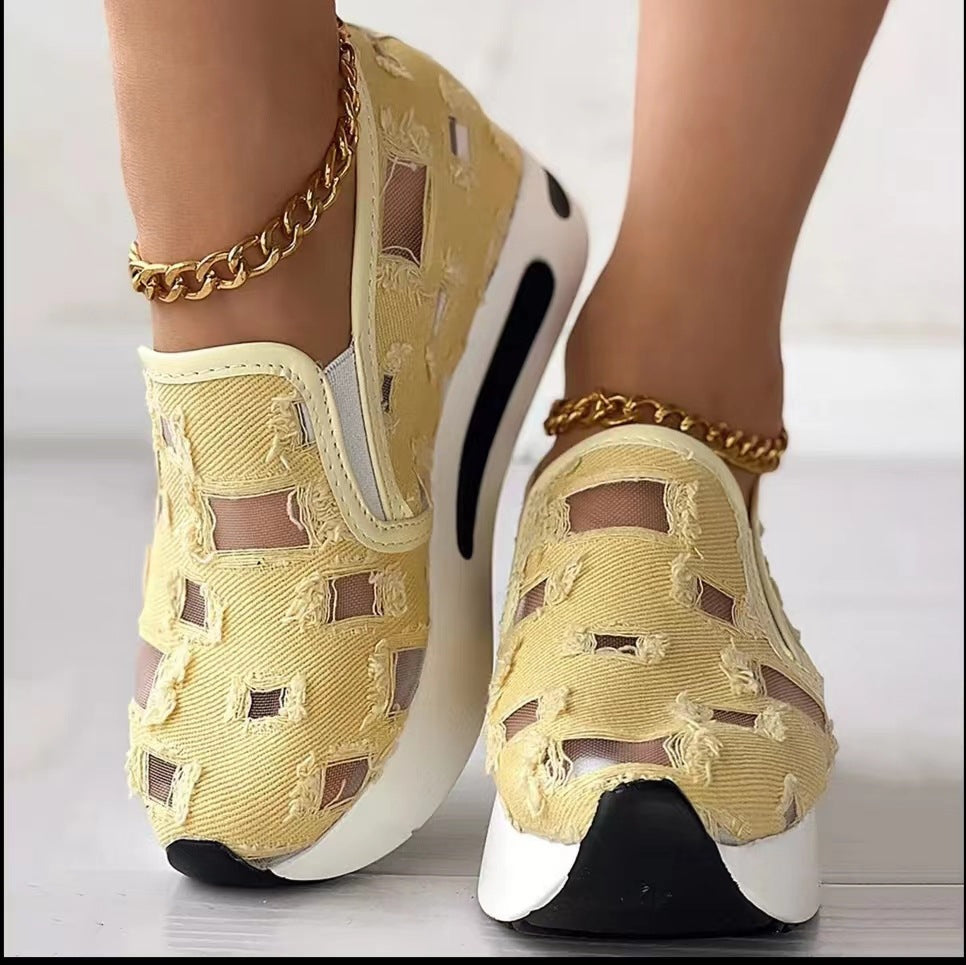 Hollow Out Canvas Shoes in pale yellow with cut-out cloth uppers and white soles with black accents, shown worn.