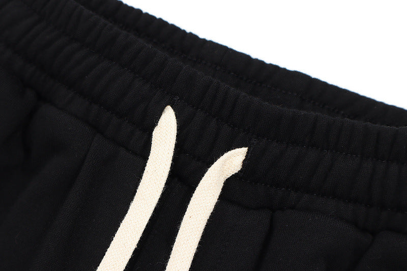 Mens Hip Hop Cotton Trousers in Black, close-up of the elasticated waistband and contrasting drawstrings