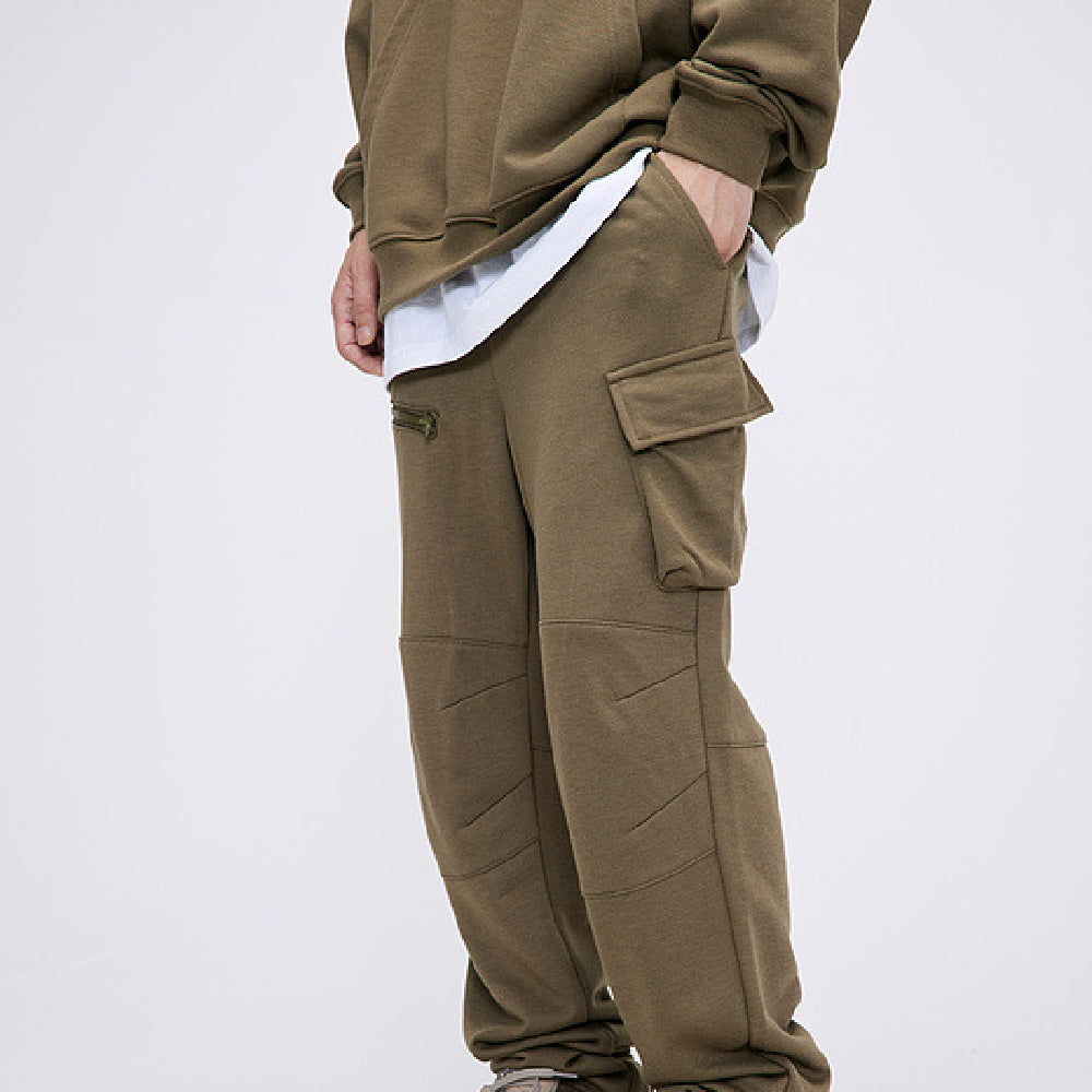 Mens Hip Hop Cotton Trousers in Green, side view on a model showing the relaxed fit and cargo pocket